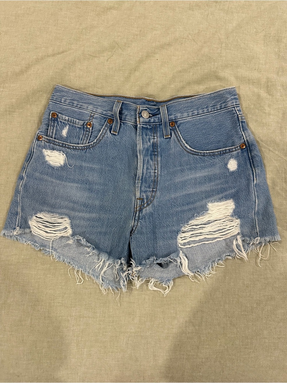 Levi’s women’s High-Rise Distressed Denim Shorts - Light Blue